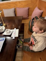 Young Child at Japanese Restaurant Table