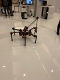 Futuristic Robot on Display with a Captivated Audience