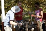 Working the Apple Press at UA Farm