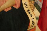 Woman Holding Banner with Man Painting