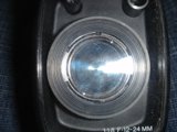 Illuminating the Zoom: A Close-Up of a Camera Lens with a Light