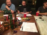 Group of Men Enjoying Beer and Papers at the Pub