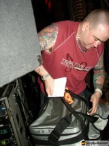 Tattooed Man with Bag