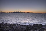 Rocky Shoreline Overlooking Bay at Sunset