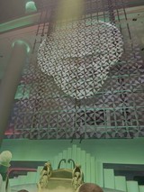 Futuristic Geometric Ceiling Installation with Green Lighting