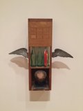 The Wooden Box with a Bird and a Bottle