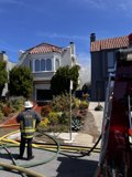 Fireman and Hydrant in the Suburbs