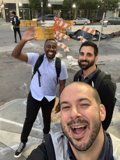 Three Men Taking a Selfie in Front of Construction Barriers in San Francisco