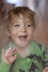 Joyful Toddler with Bright Smile and Wavy Hair