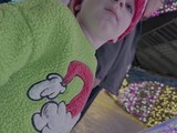Child with Mickey Mouse Plush and Sequin Top