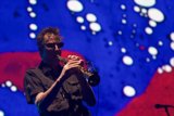 Man in sunglasses plays flugelhorn on Coachella stage