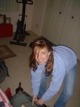 Woman Packing Bags in a Home Living Room