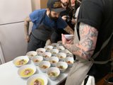 Tattooed Man Indulging in a Delicious Meal