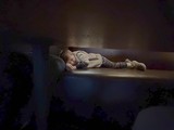 Child Sleeping Peacefully on Living Room Sofa