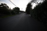 Quiet Residential Street at Dusk with Overhead Power Lines