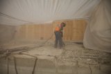 Working on the Concrete Floor