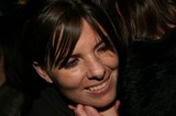 Joyful Woman Smiling During Warm Embrace