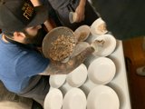 Tattooed Man Preparing a Meal