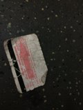 Red Sticker on a Piece of Paper