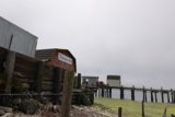 Wooden Pier with Waterfront Building