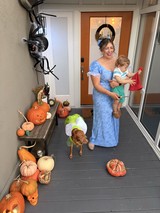 Halloween Porch Display with Family in Costume