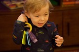 Toddler Playing with Toy Keys at Christmas