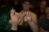 Green-Haired Man Quenches His Thirst