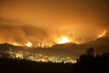 Blaze Engulfs Cityscape in Station Fire