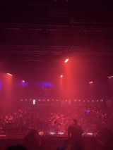 Electronic Music Concert Under Red and Blue Stage Lights