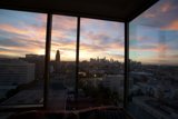 Urban Sunset from a High-Rise Window
