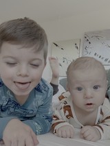 Big Brother Making Baby Smile at Home