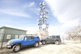 SUVs Parked by the Cell Tower