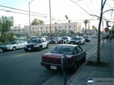 A City Street with Parked Cars and a Police Car