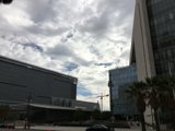 Building Triumphantly Rises Amidst Cloudscape