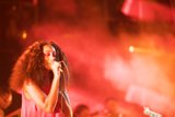Solange Portrait Eyes Closed Guitarist Background Red Pink