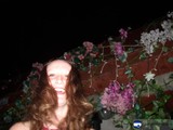 Smiling Lady Amongst Geraniums