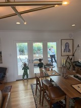 Family Moment Through Glass Doors at Home
