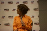 Woman Empowering the Crowd with Her Speech