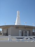 Serene White Building with a White Fence