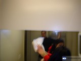 Woman holding a white cloth near the sliding door