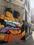 Cartoon Character Mural on Urban Building