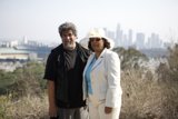 A Happy Couple in Front of the Cityscape