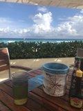 Refreshing Drink and Bucket of Food by the Ocean