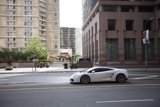 White Sports Car Cruising through the Metropolis