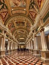 Ornate Barrel-Vaulted Gallery with Classical Columns and Frescoes
