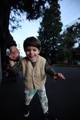 Child's Joyful Evening Walk in Suburban Neighborhood
