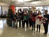 Office Team Celebrates Christmas with Ugly Sweaters
