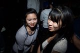 Two Smiling Women at a Night Club Party