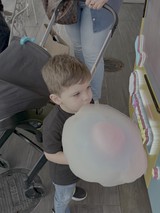 Young Boy Enjoying Cotton Candy Treat