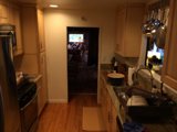 Wooden flooring and modern appliances in Altadena kitchen